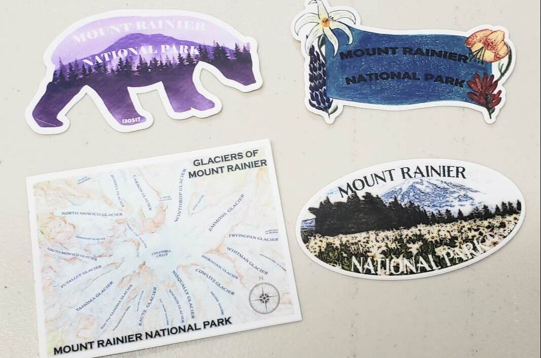 Image of four mountain-themed stickers